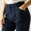 Close-up of the navy trousers showing the waistband, button fastening and front pockets.