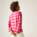 Rear view of model wearing the pink long-sleeved striped top with red stripes.