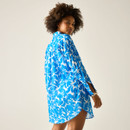 Back and side view of a blue and white floral print longline shirt worn by a model.