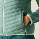 Close-up of the jacket’s zipped side pocket and quilted insulation detail.