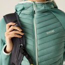 Close-up of the quilted front panel and zip fastening on the green hooded jacket with Regatta branding.