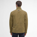 Rear view of a person wearing an olive green jacket with a high collar, standing against a plain white background. The style is casual and relaxed.