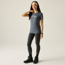 Full-length view of a women’s slate-grey “Nature” graphic T-shirt styled with black leggings and walking boots.
