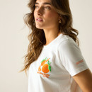 Side profile close-up of the white T-shirt with orange graphic detail on the chest.