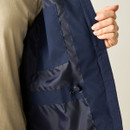 Close-up of the inside of the navy waterproof jacket showing the adjustable waist drawcord.