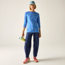 Women’s blue and white striped long-sleeve t-shirt styled with jeans.