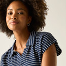 Close-up of women’s navy and white striped polo-style top with open collar.