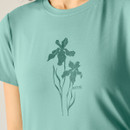 Close-up of floral graphic on women’s ivy green stretch t-shirt.