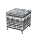 Square grey rattan garden side table with glass top, shown on a white background.