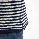 Close-up of the navy and white striped textured knit showing the side split hem detail.