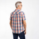 Back view of man wearing a short-sleeve cream and orange check shirt.