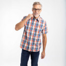 Man wearing a short-sleeve cream, orange and navy check shirt with button-up front.