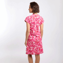 Rear view of pink tropical print dress with short sleeves and relaxed fit.