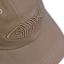 Close-up of embroidered fish skeleton logo on stone-coloured twill cap brim.