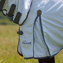 Close-up of Highlander Plus logo and side straps on a white fly rug.