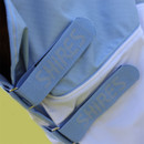 Close-up of Shires branded front straps on a light blue and white horse turnout rug with neck cover.