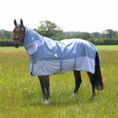 Side view of a horse modelling a light blue and white turnout rug with integrated neck cover outdoors.