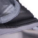 Close-up of Shires branded adjustable straps on a grey mesh fly mask.