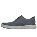Casual blue-grey lace-up trainer with a textured fabric upper and a thick, white rubber sole. The design is simple and understated, conveying a relaxed tone.