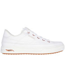 White trainer with rose gold eyelets and a tan gum sole. The shoe features white laces, a minimalist design, and a label on the side.
