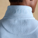 Close-up of the back of the light blue fleece collar showing embossed Joules branding.