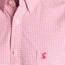 Close-up of pink gingham shirt front highlighting the chest pocket and embroidered hare logo.