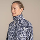 Close-up of model wearing the abstract print half-zip fleece showing the high collar and zip pull.