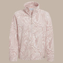 Front view of a pale pink patterned half-zip fleece laid flat, showing the high collar and long sleeves.