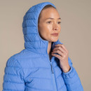 Close-up of model wearing a blue hooded Craghoppers insulated jacket with zip fastened.