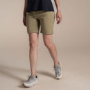 Model wearing khaki women’s walking shorts with grey trainers, side view on studio background.