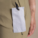 Close-up of Craghoppers glasses wipe cloth attached to zip pocket on khaki walking shorts.