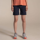 Front view of navy women’s hiking shorts on a model, shown with an orange top and trainers.