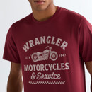 Close-up of ruby wine Wrangler graphic T-shirt showing “Wrangler Motorcycles & Service” print and motorcycle design.
