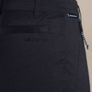 Close-up of rear pocket and Craghoppers logo with Prostretch label on black trousers.