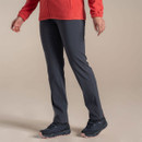 Model wearing dark grey Craghoppers walking trousers, side view, paired with red fleece jacket and hiking shoes.