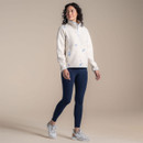 Full-length shot of a model wearing an off-white sherpa fleece pullover with blue floral embroidery and pale blue trim.