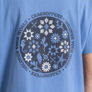 Close-up of the large circular Craghoppers back graphic print on a light blue T-shirt.