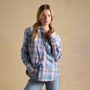 Model wearing a women’s pastel blue checked long-sleeve button-down shirt with a chest pocket, styled with blue jeans.