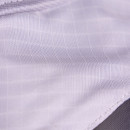 Close-up of the fine black mesh screen and grey binding on the fly mask for airflow and insect protection.