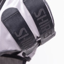 Detail of the black woven fastening straps on the fly mask, showing textured webbing.