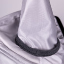 Detail of the fly mask ear cover with grey fleece trim and ripstop-style fabric texture.