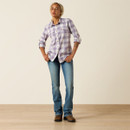 Full-body front view of the model wearing the plaid button-up shirt with blue jeans and brown work boots.