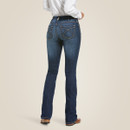 Full-length back view of the model wearing dark-wash bootcut jeans and western boots.