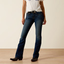 Three-quarter front view highlighting the fit and bootcut shape of the dark-wash jeans.