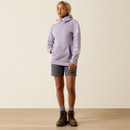 Full-body front view of the lavender half-zip hoodie styled with grey shorts, socks, and work boots.