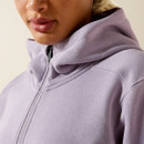 Close-up of the half-zip neckline and hood, showing the zipper pull and stitching details.