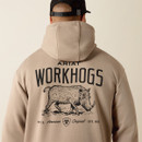 Close-up of the back of a tan hoodie showing the “ARIAT WORKHOGS” text and boar graphic print beneath the hood.