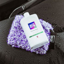 Autoglym Polar Seal bottle resting on a purple wash mitt on a wet car seat.