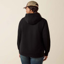 A person wearing a black hoodie and a beige baseball cap is shown from behind against a neutral background, conveying a casual, relaxed mood.