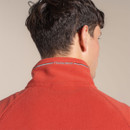 Close-up of the back of the collar on the orange fleece, showing the Craghoppers branding across the neckline.